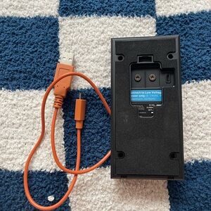 Orange USB Cable and Black Device